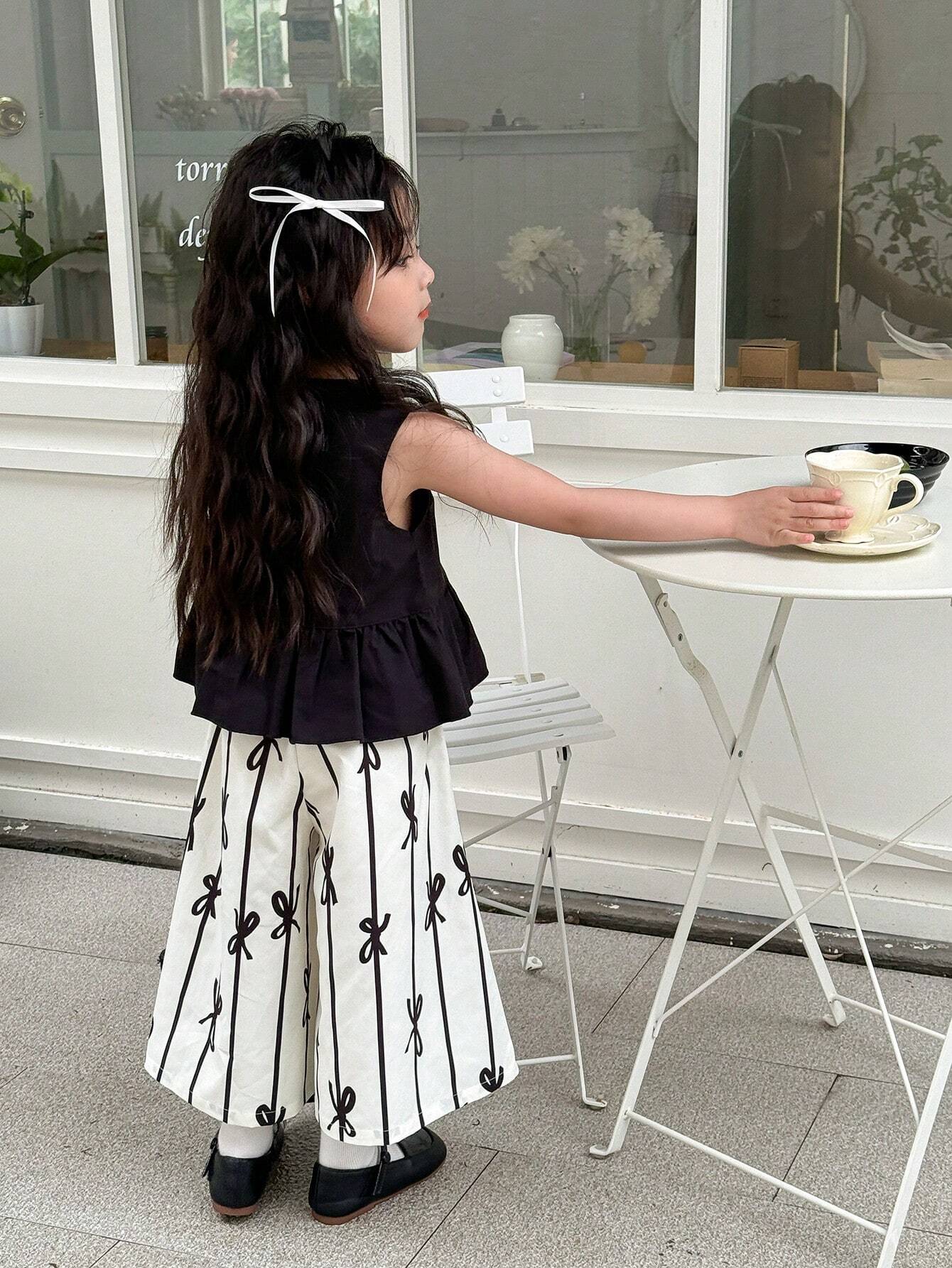 Young Girl Solid Color Round Neck Sleeveless Top With Ruffled Hem And All-Over Print Long Pants