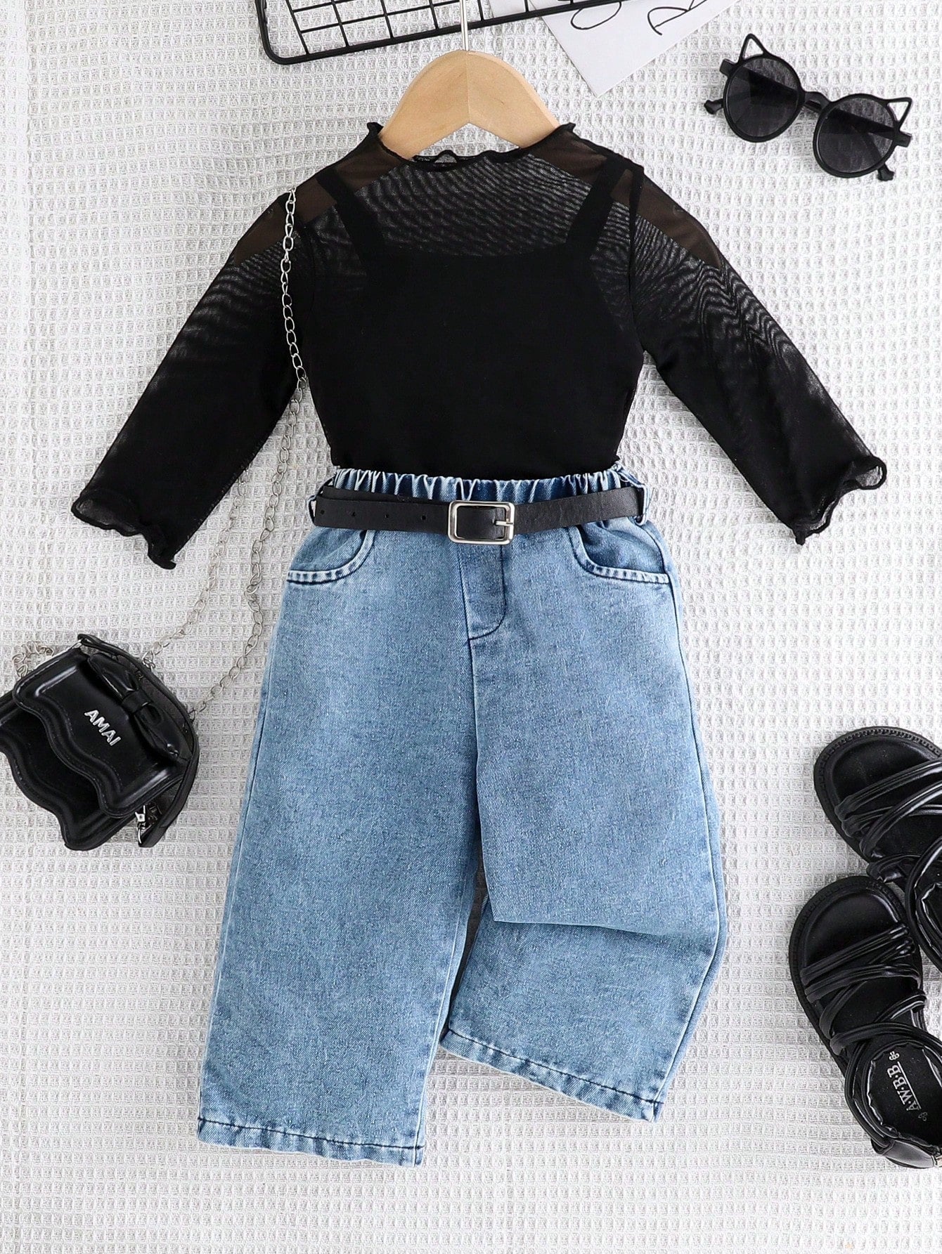 Black Mesh Top, Matching Camisole, And Blue Denim Pants