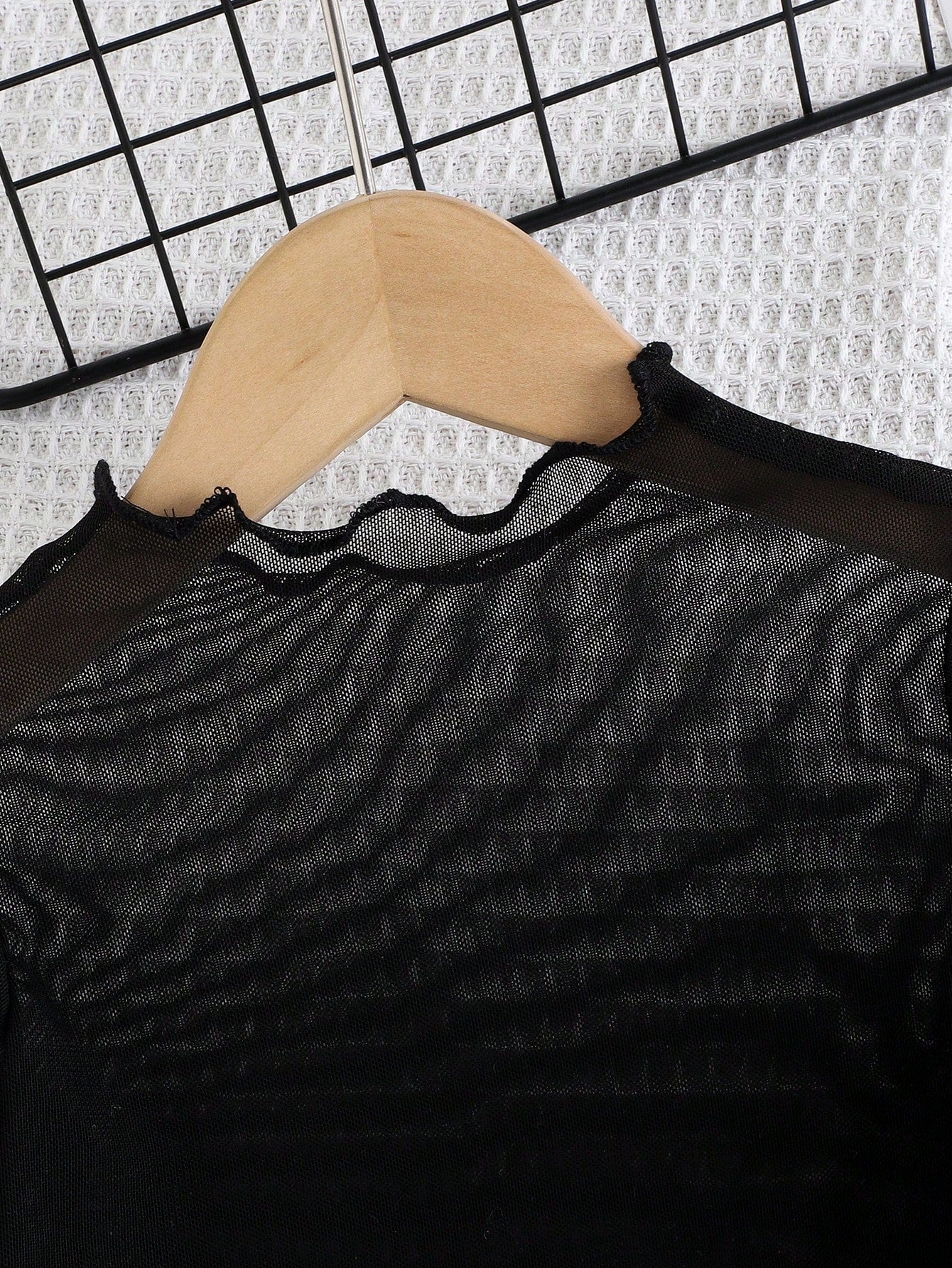 Black Mesh Top, Matching Camisole, And Blue Denim Pants