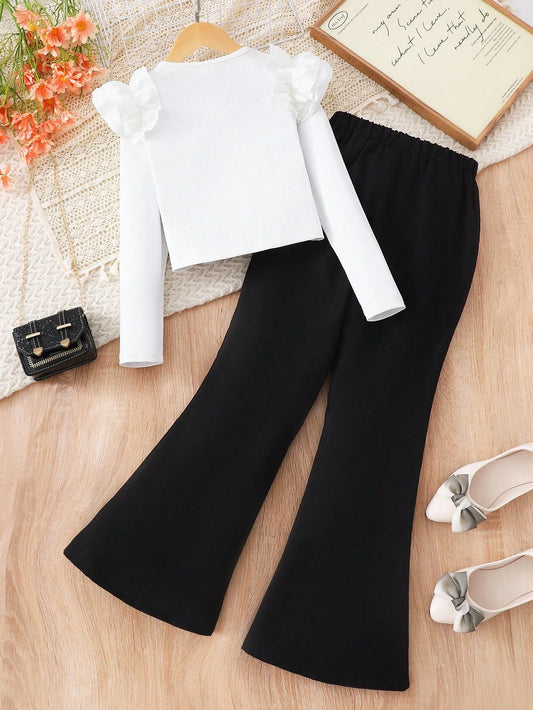 Elegant Casual Outfit, White Knit Top Paired With Black Flared Pants