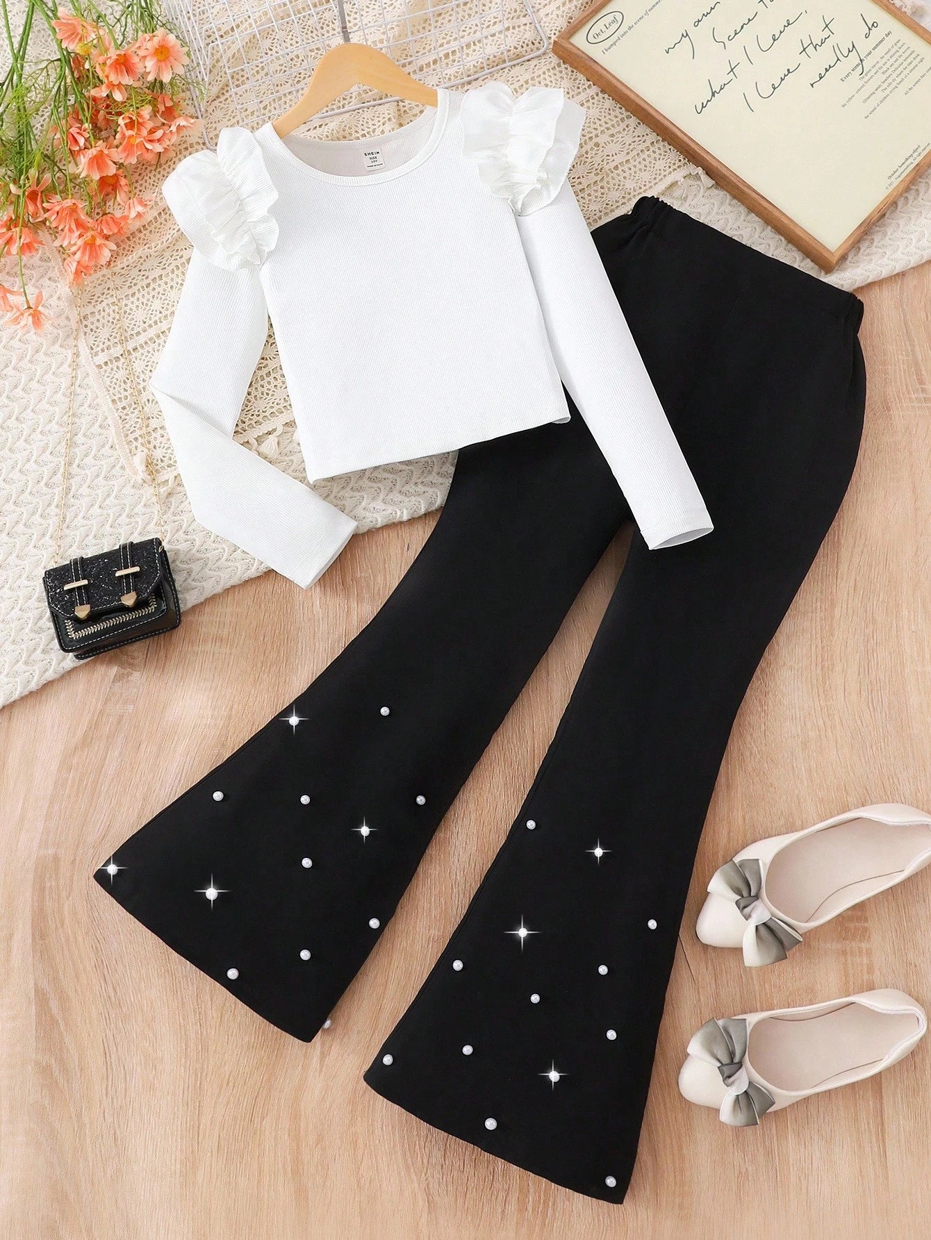 Elegant Casual Outfit, White Knit Top Paired With Black Flared Pants